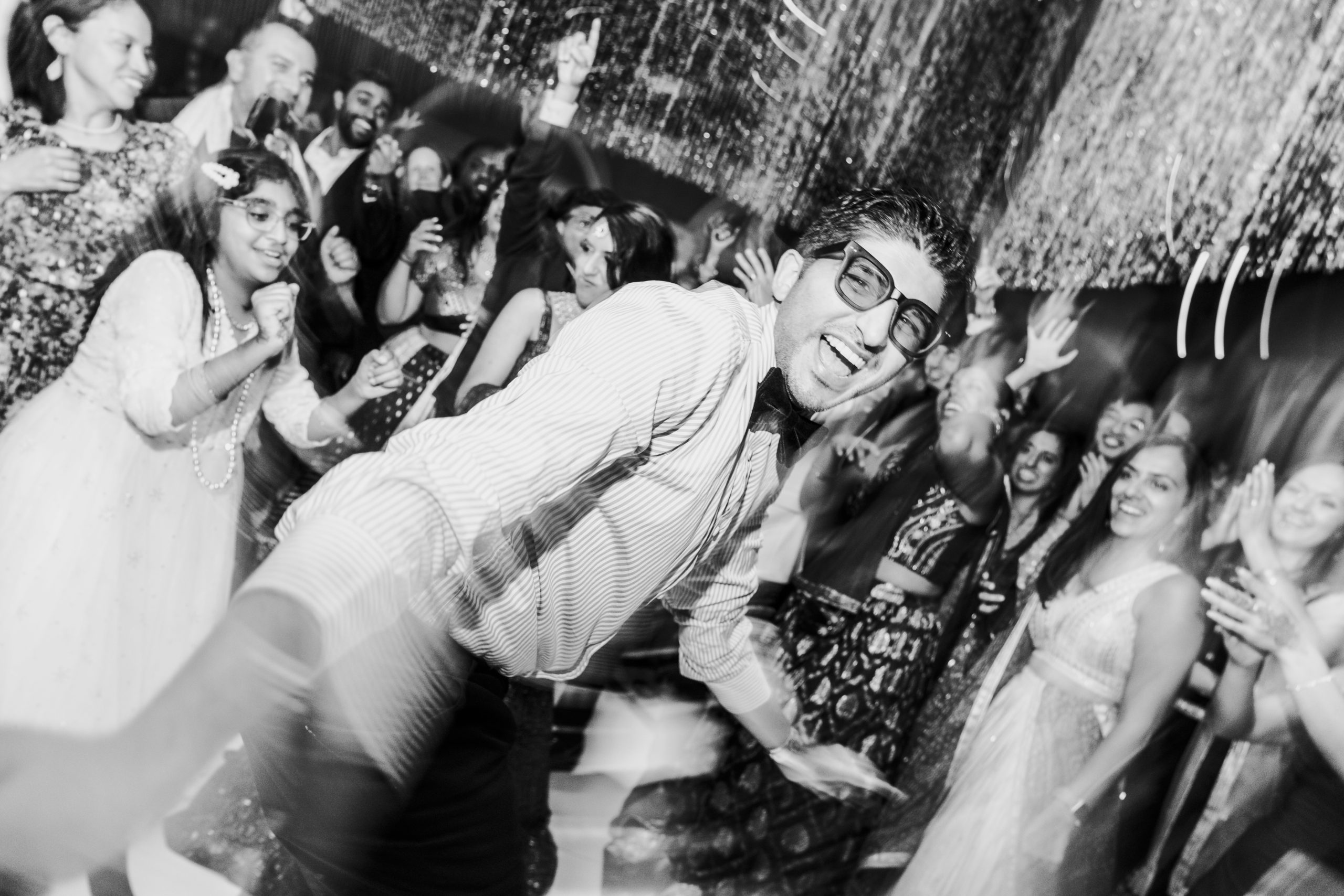 a wedding guest gets down and dirty during the open dancing portion of the wedding reception 